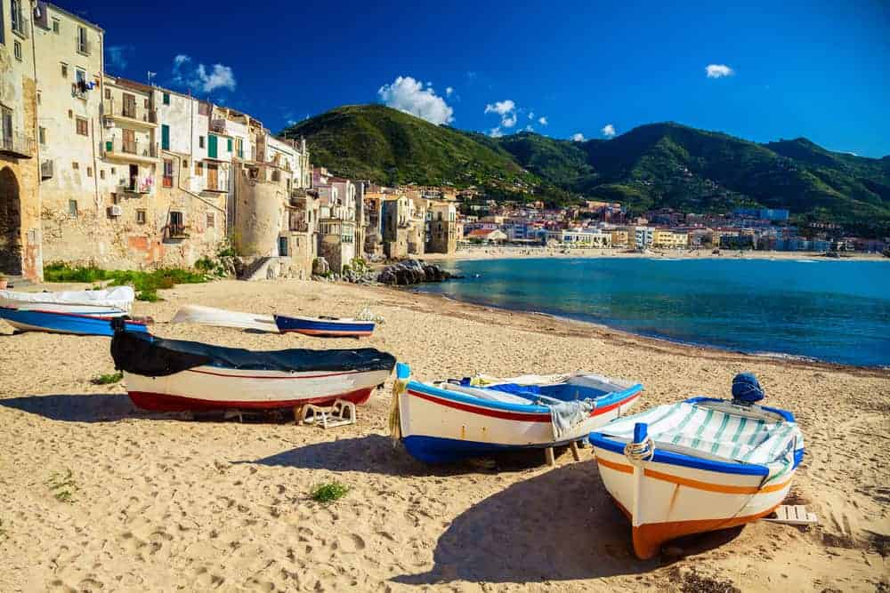 Where to find winter sun in Europe. Cefalu beach in Sicily.